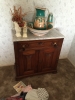 wooden-cabinet-with-hand-painted-ceramic-dishware-1426655167.jpg